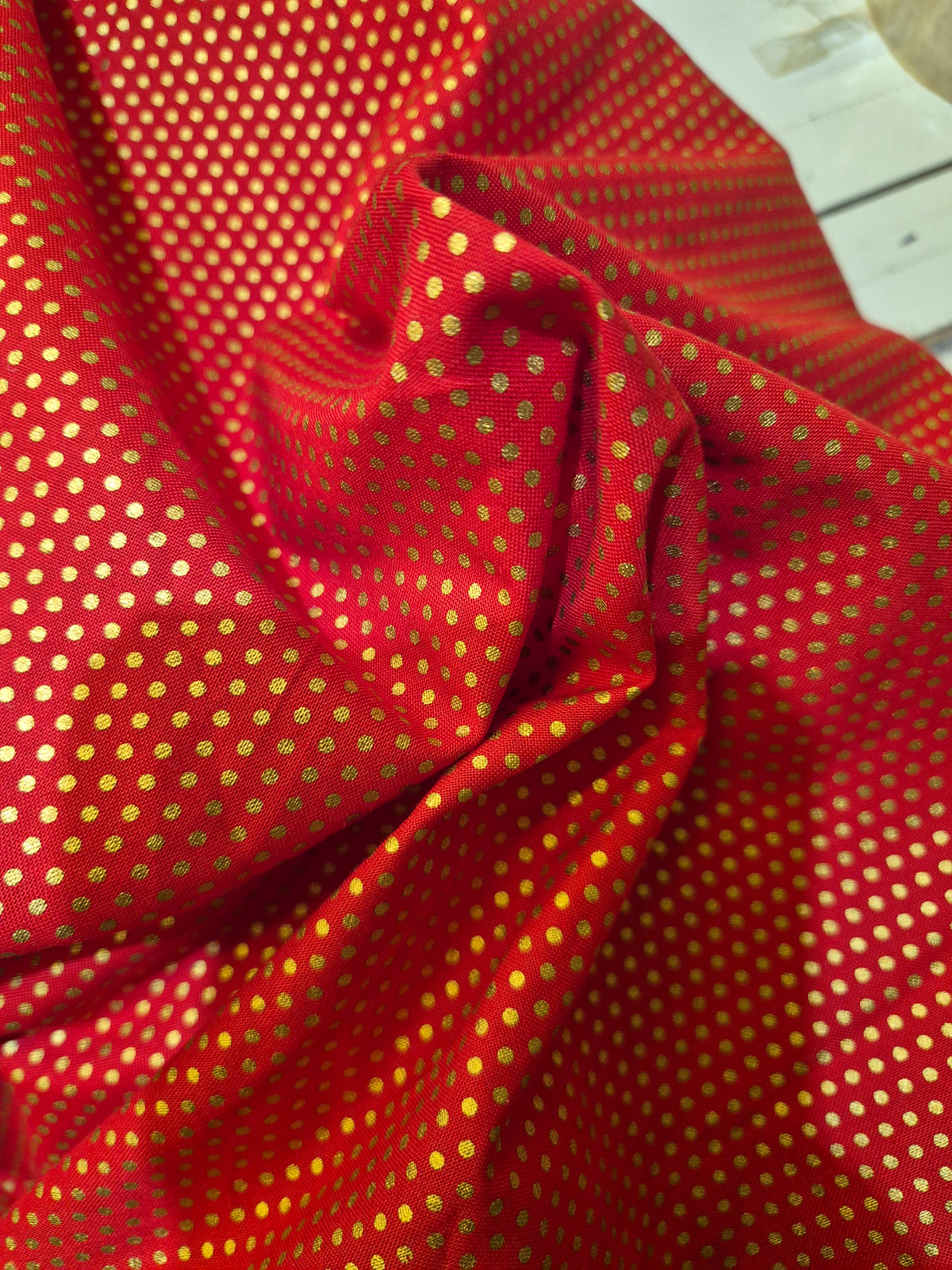 Small Gold Spot on Red Cotton