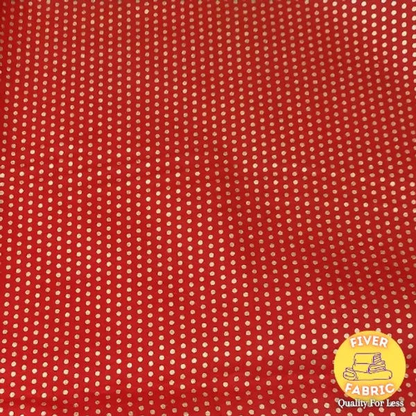 Gold spots on red cotton