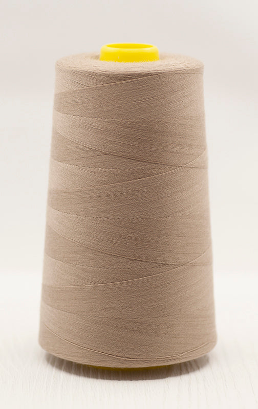 Beige overlocker cone of thread