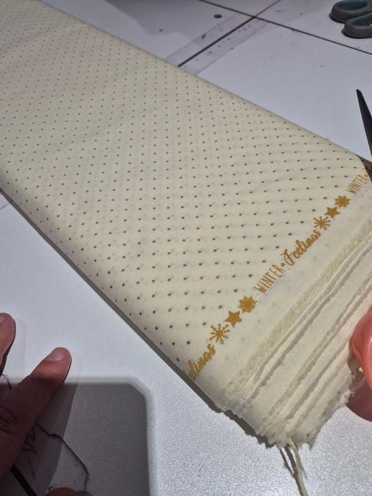 Gold spot on cream cotton
