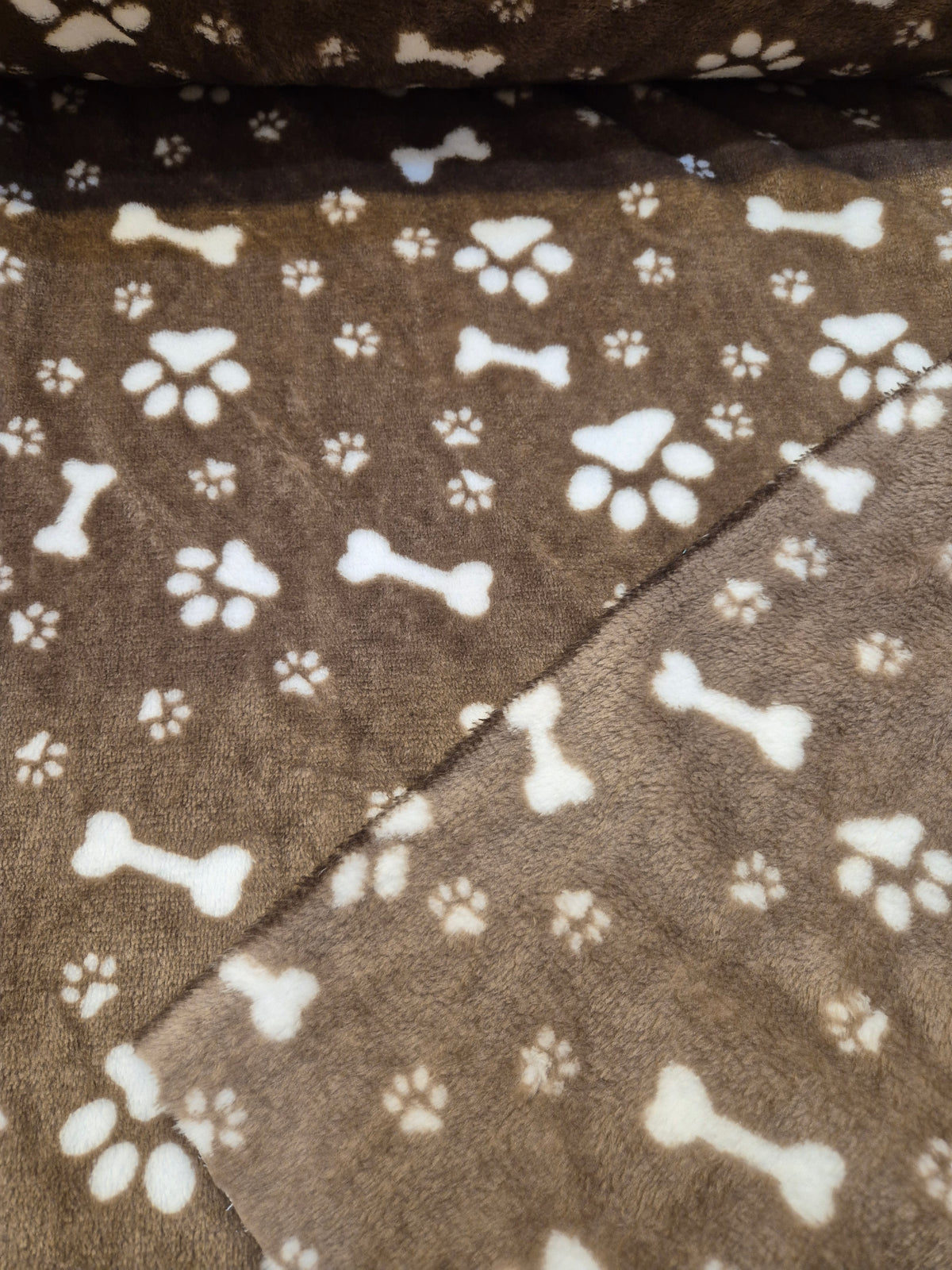 Bones and paws on brown cuddle fleece