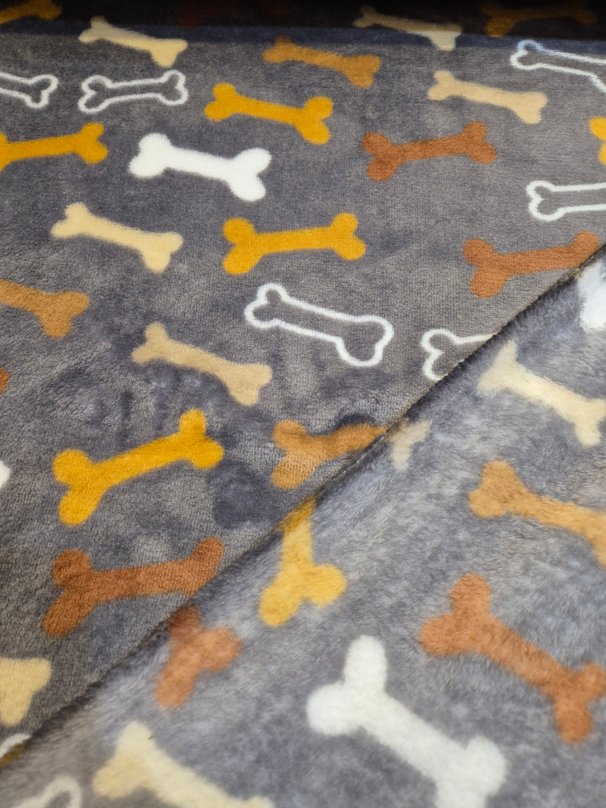Multi colour Bones on grey cuddle fleece