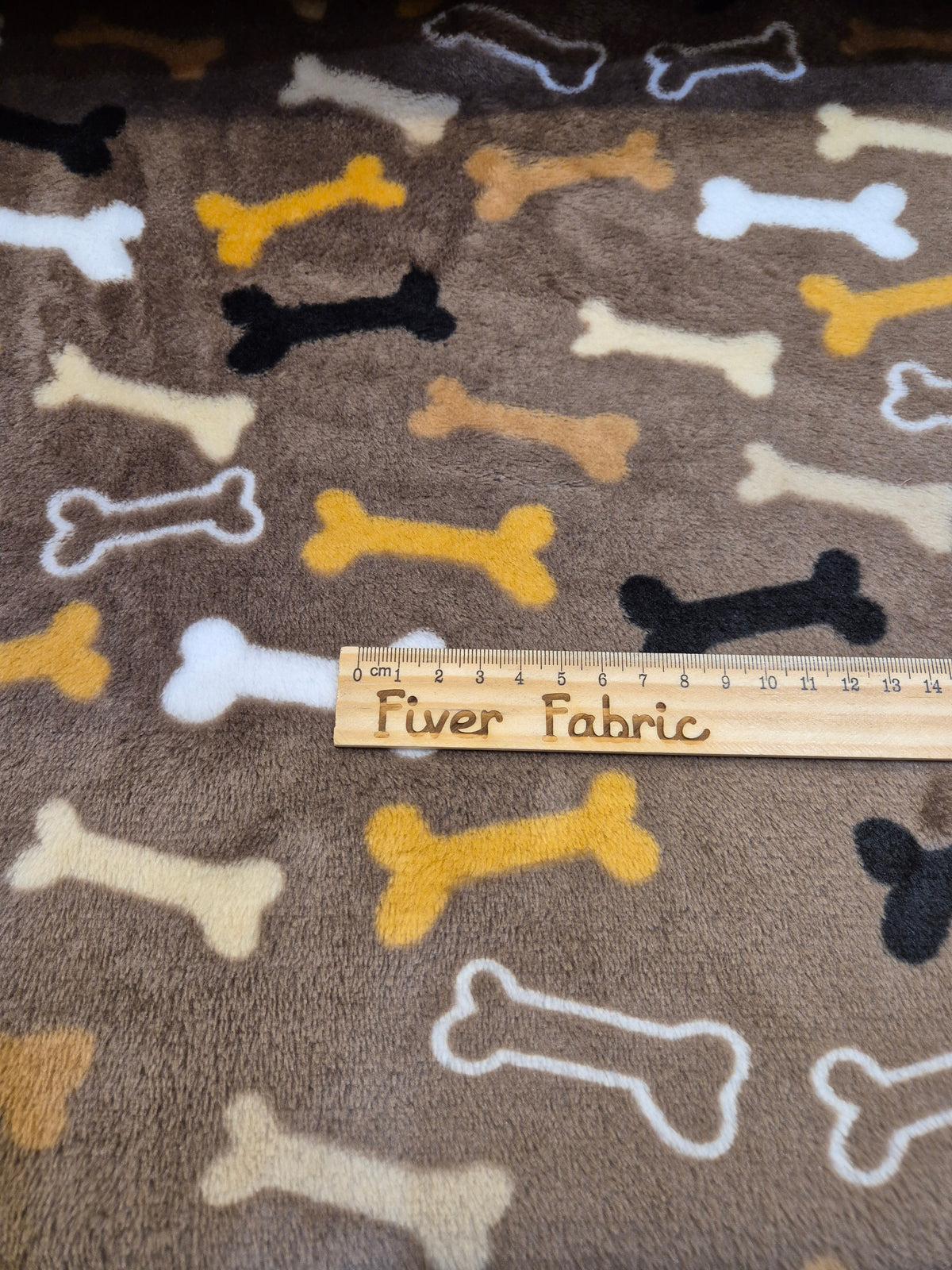 Multi colour Bones on brown cuddle fleece