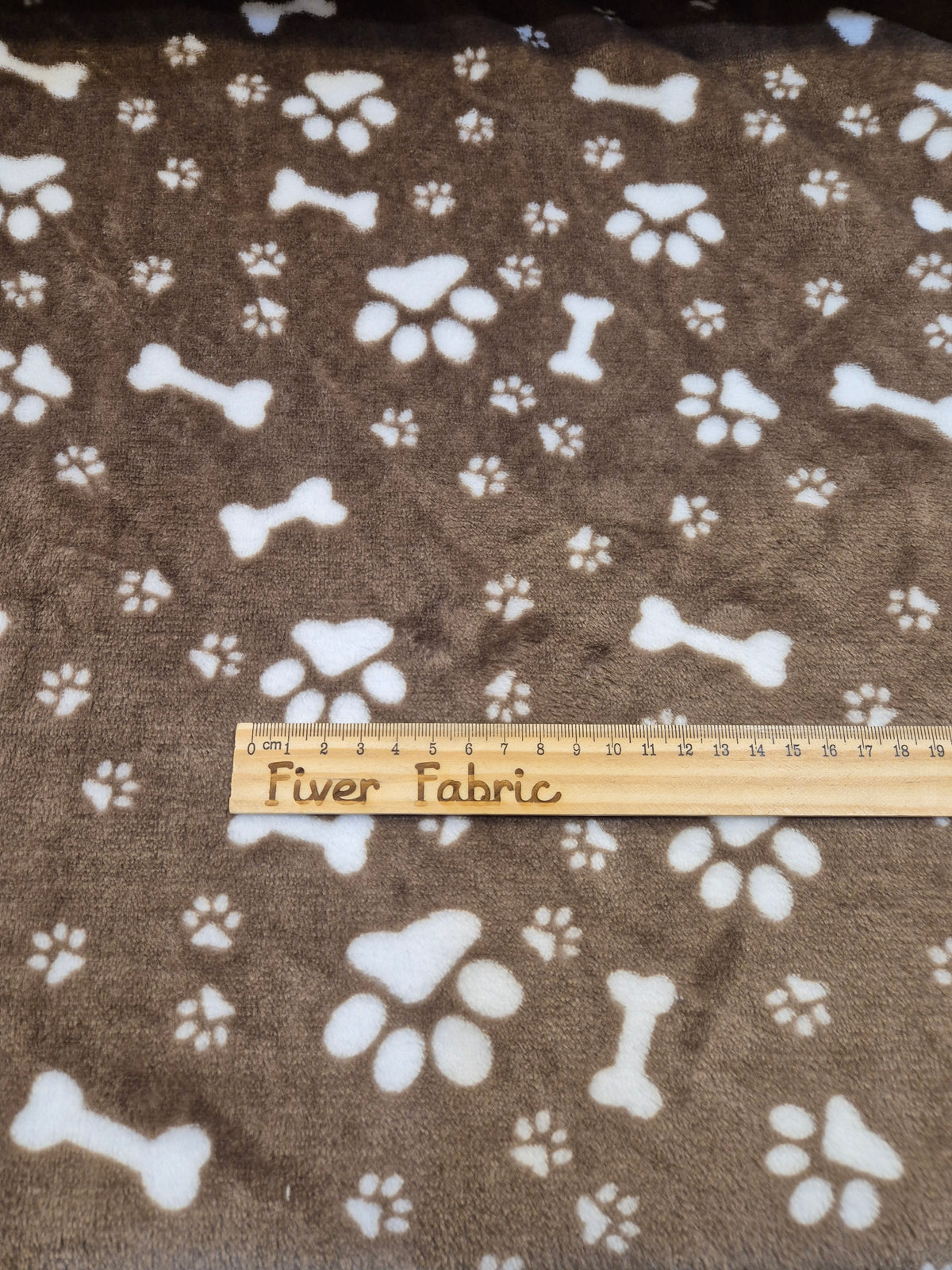 Bones and paws on brown cuddle fleece