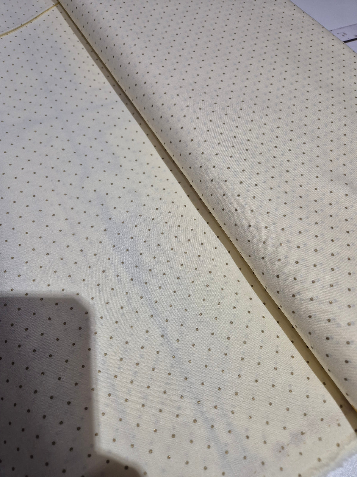 Gold spot on cream cotton