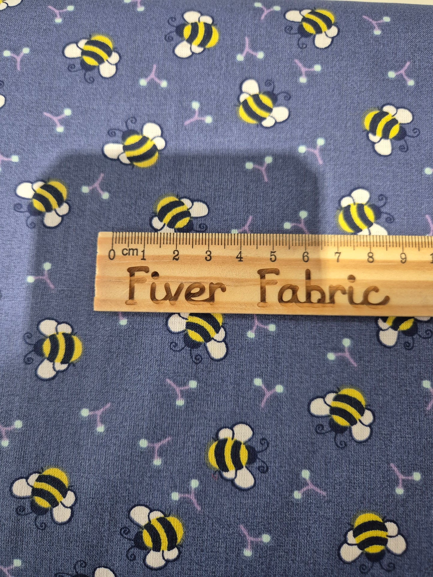 100% cotton bees on blue